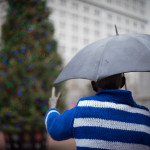 portland photos - portland pictures - portland images - christmas in portland - pioneer courthouse square - christmas tree - christmas sweater - man with umbrella